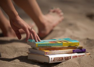 Image of books on a beach