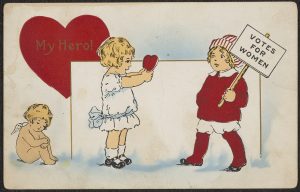 Valentine showing girl holding out heart to boy holding "Votes for Women" picket sign with the text "My Hero!"