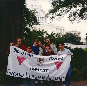 Students in Washington D.C. holding a banner for GALA, the Gay and Lesbian Alliance at JHU.