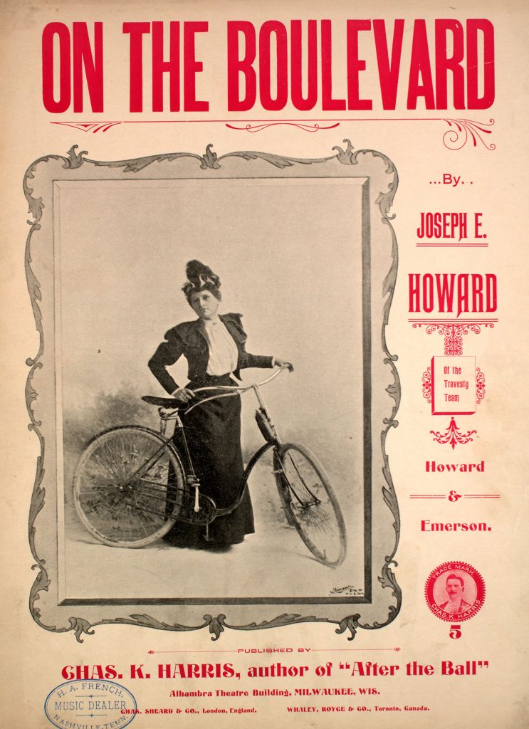 sheet music cover with woman and bicycle