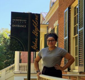 Lauren Degener stands in front of Homewood's Gift Shop door. 