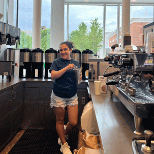 Student barista at Brody Cafe in Brody Learning Commons