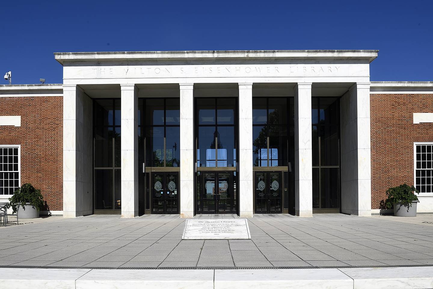 exterior of building with columns and glass entrance