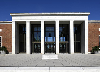 exterior of building with columns and glass entrance