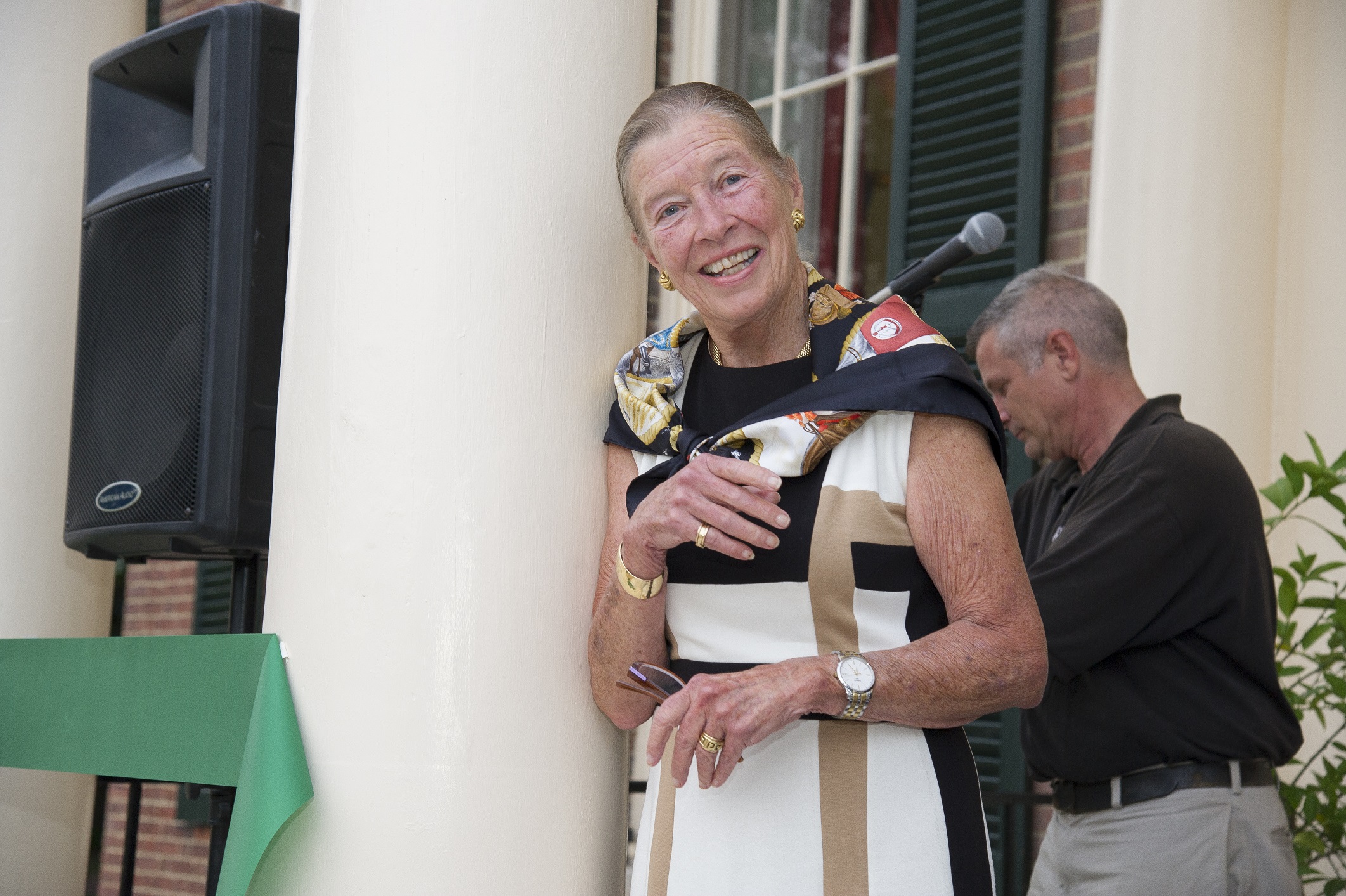 Aurelia Garland Bolton stands on Homewood Museum's South Portico after having cut the green ribbon at the museum's 25th anniversary celebration in 2012.